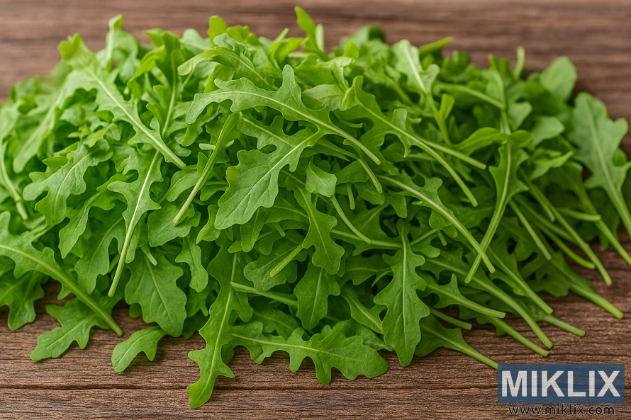Freshly harvested arugula leaves piled in baskets on a rustic wooden table